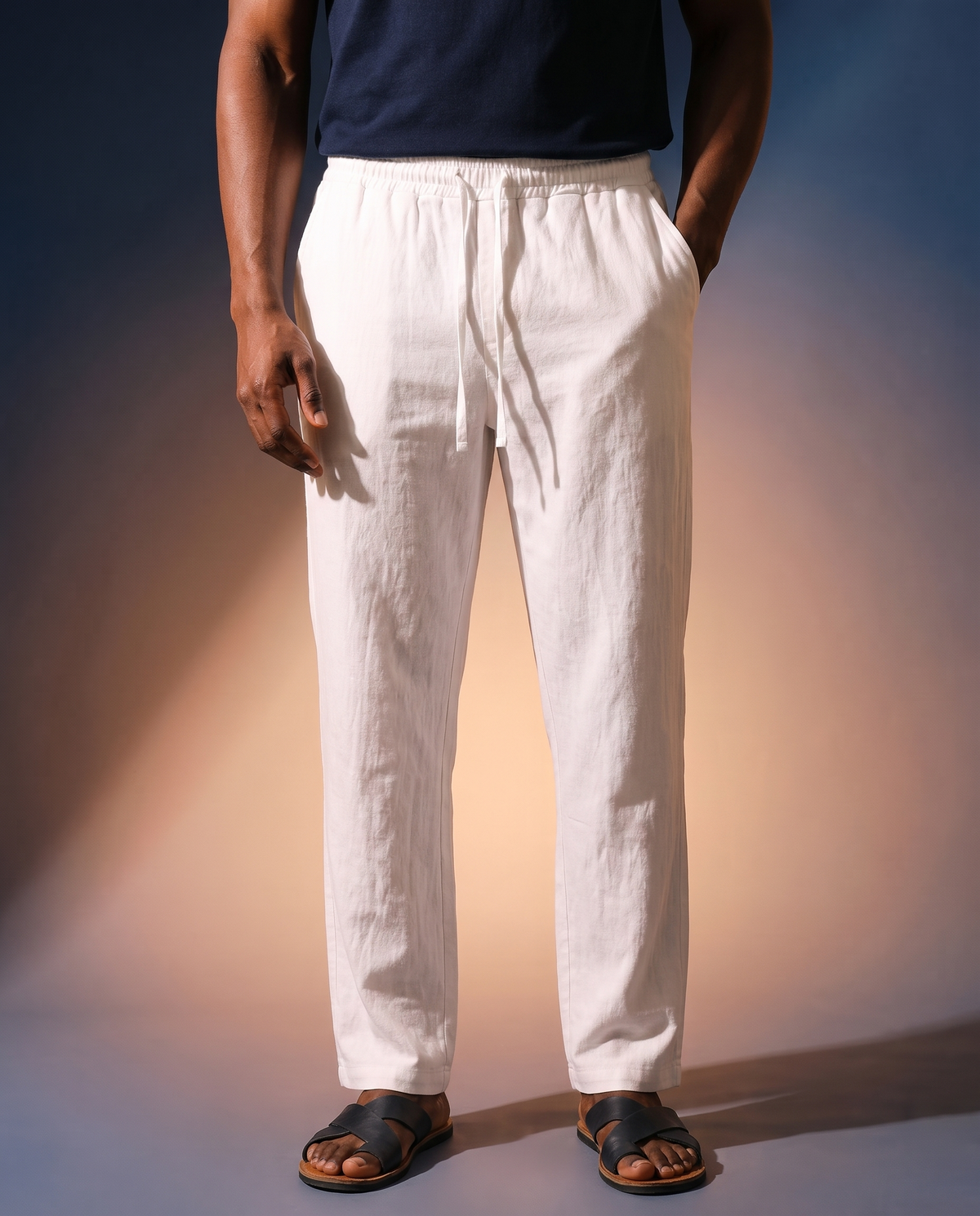 Men's Linen Drawstring Trousers in white on model, going out pants