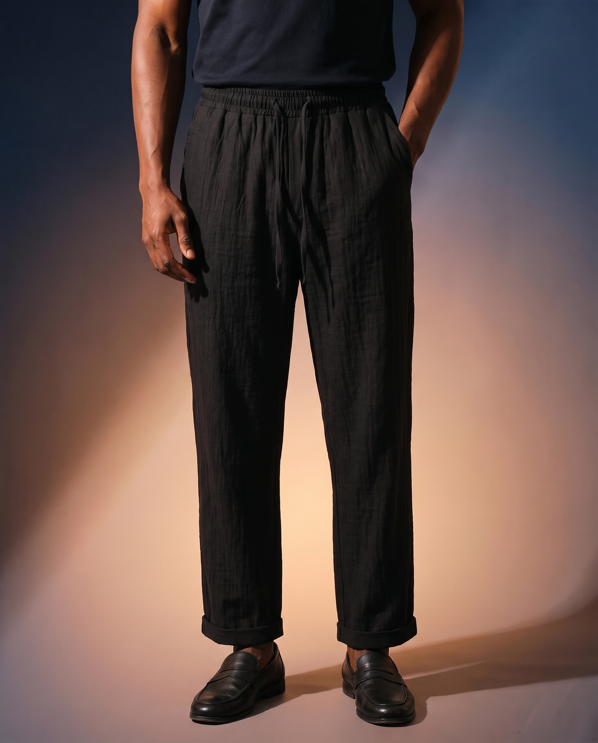 Men's Linen Drawstring Trousers in black on model, going out pants