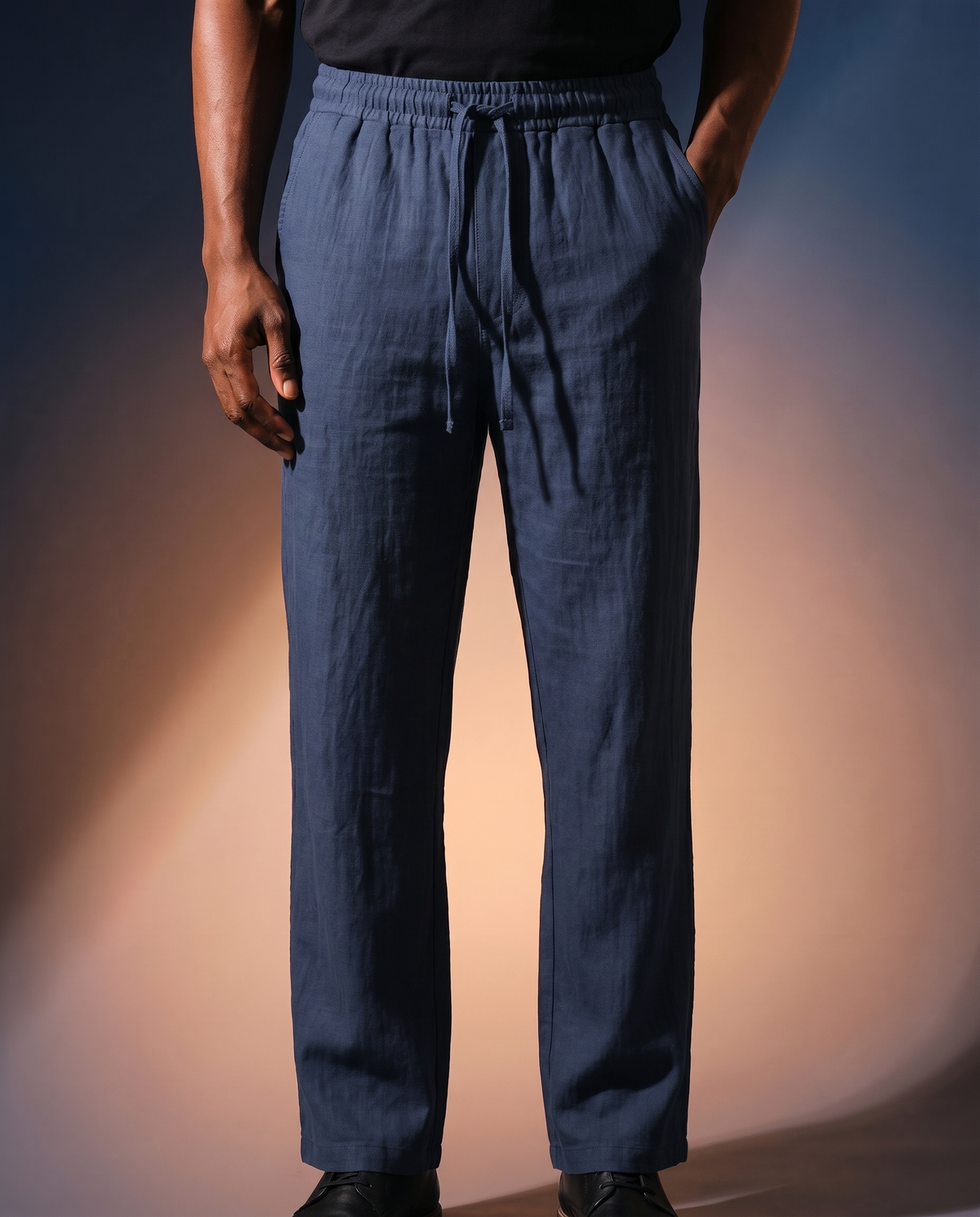 Men's Linen Drawstring Trousers in navy blue on model, going out pants