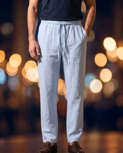 Men's Linen Drawstring Trousers in light blue on model, going out pants