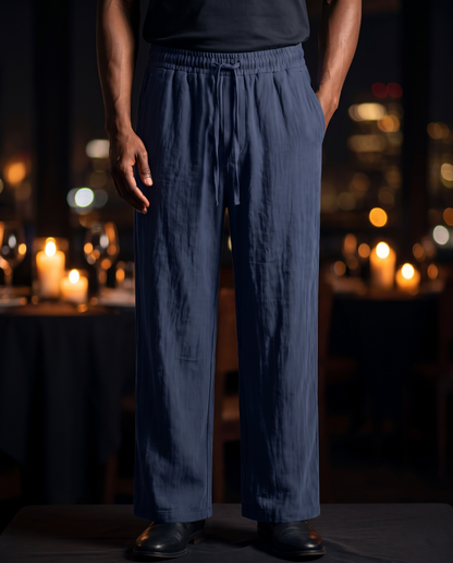 Men's Linen Drawstring Trousers in navy blue on model, going out pants